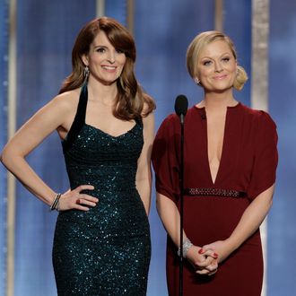 BEVERLY HILLS, CA - JANUARY 13: In this handout photo provided by NBCUniversal, L to R Tina Fey and Amy Poehler host the 70th Annual Golden Globe Awards at the Beverly Hilton Hotel International Ballroom on January 13, 2013 in Beverly Hills, California. (Photo by Paul Drinkwater/NBCUniversal via Getty Images)