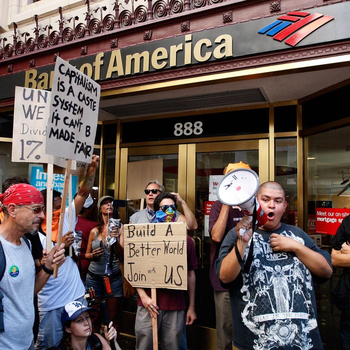  Protesters stop to demonstrate outside a Bank of America branch in Los Angeles, California. 