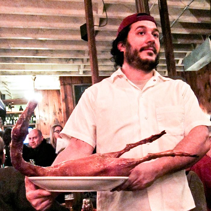 Mirarchi serves a roast duck.