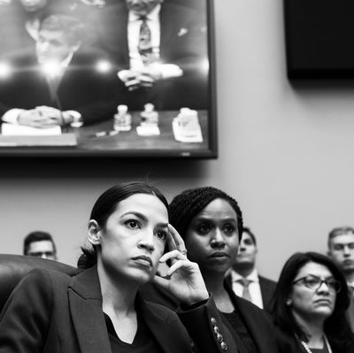 Alexandria Ocasio-Cortez, Ayanna Pressley and Rashida Tlaib during Michael Cohen's Congressional testimony.