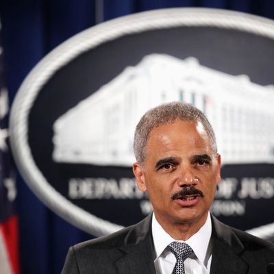 WASHINGTON, DC - AUGUST 21: Attorney General Eric Holder makes a separated statement on the unrest after the unarmed 18-year-old Michael Brown was shot by a police officer in Ferguson, Missouri, during a major financial fraud announcement press conference August 21, 2014 at the Justice Department in Washington, DC. Holder spoke on the current situation in Ferguson one day after his visit to the town and met with Brown’s family, saying the investigation of the shooting will be thorough and will be fair, and Department of Justice stands with the people of Ferguson. (Photo by Alex Wong/Getty Images)