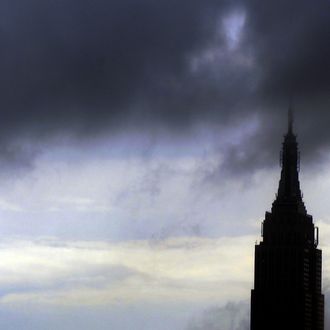 Rain and dark clouds PASS over the Empire State Buidling in New York ON August 25 ,2011. New York City is bracing for the arrival of Hurricane Irene. Forecasters are expect it to move up the east coast, where it could hit New York City by late Saturday or Sunday. AFP PHOTO / TIMOTHY A. CLARY (Photo credit should read TIMOTHY A. CLARY/AFP/Getty Images)
