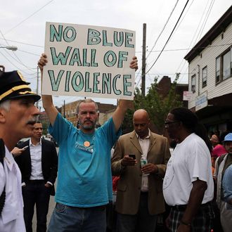 NEW YORK, NY - JULY 19: People participate in a demonstration against the death of Eric Garner after he was taken into police custody in Staten Island on Thursday on July 19, 2014 in New York City. New York Mayor Bill de Blasio announced in a news conference yesterday that there will be a full investigation into the circumstances surrounding the death of Garner. The 400-pound, 6-foot-4 asthmatic, Garner (43) died after police put him in a chokehold outside of a convenience store for illegally selling cigarettes. (Photo by Spencer Platt/Getty Images)