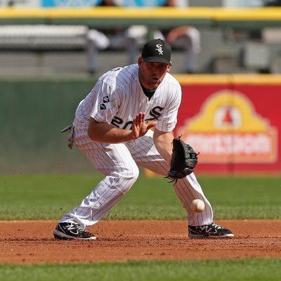 Kevin Youkilis #20 of the Chicago White Sox fields a ball against the Cleveland Indians at U.S. Cellular Field on September 25, 2012 in Chicago, Illinois. The Indians defeated the White Sox 4-3. 