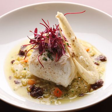 Slow-roasted halibut with Berber spice dust and sweet yellow lentils.