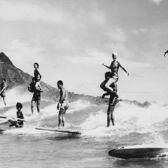 Surfers in Hawaii, for a post on the best wetsuits and rash guards according to surf instructors — The Strategist
