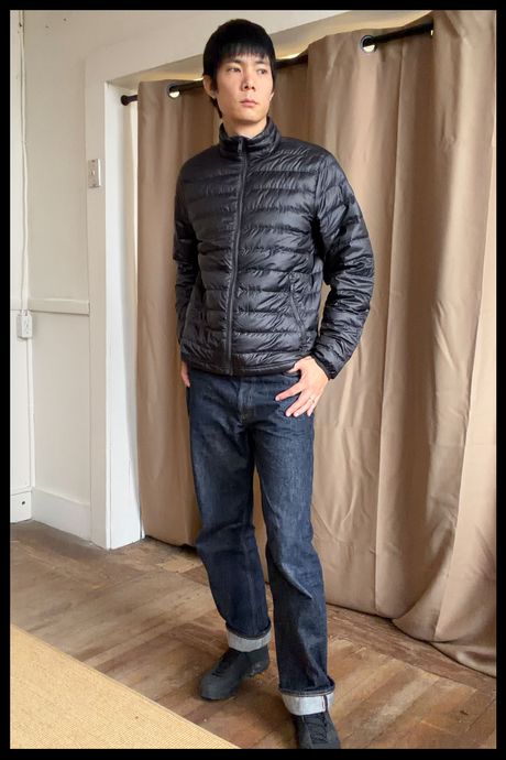 Photo of Strategist senior writer Michael Zhao wearing the Quince Men’s Lightweight Down Packable Puffer.