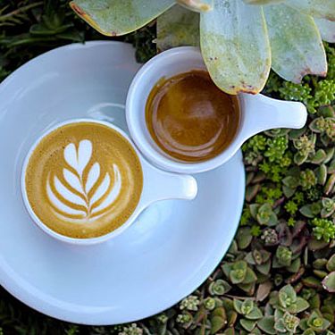 Order the One-and-One: a single macchiato and single espresso placed together on a shared saucer.