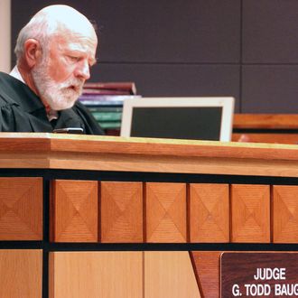 Montana District Judge G. Todd Baugh reads a statement in his Billings courtroom on Friday, Sept. 6, 2013, explaining his 30-day sentence for a teacher who raped a student. Baugh had sought a re-sentencing hearing for defendant Stacey Rambold, but was blocked by the state Supreme Court.