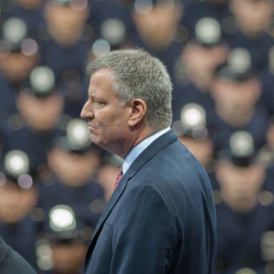 Police Commissioner WILLIAM BRATTON and Mayor BILL DE BLASIO look on at the New York City Police Academy Graduation Ceremony, Madison Square Garden, Mon., Dec. 29, 2014.