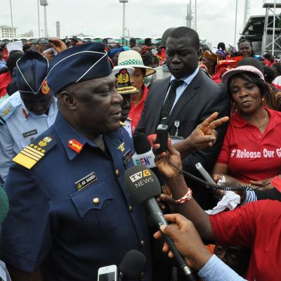 Nigeria's chief of defense staff Air Marshal Alex S. Badeh, centre, speaks during a demonstration calling on the government to rescue the kidnapped girls of the government secondary school in Chibok, in Abuja, Nigeria, Monday, May 26, 2014. Scores of protesters chanting 