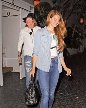 75902, LOS ANGELES, CALIFORNIA - Friday April 6, 2012. Singer Lana Del Rey seen leaving the trendy hangout Chateau Marmont with former Guns and Roses frontman Axl Rose. Photograph: ?Josephine Santos, PacificCoastNews.com **FEE MUST BE AGREED PRIOR TO USAGE** **E-TABLET/IPAD & MOBILE PHONE APP PUBLISHING REQUIRES ADDITIONAL FEES** LOS ANGELES OFFICE:+1 310 822 0419 LONDON OFFICE:+44 20 8090 4079