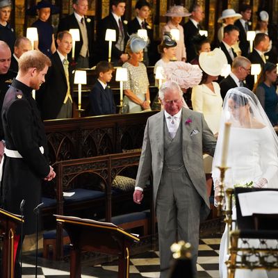 Prince William, Prince Harry, Prince Charles, and Meghan Markle at the royal wedding.