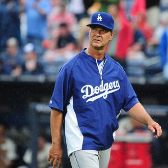 Manager Don Mattingly #8 of the Los Angeles Dodgers heads back to the dugout after making a pitching change against the Atlanta Braves at Turner Field on May 19, 2013 in Atlanta, Georgia.