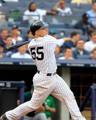 Russell Martin #55 of the New York Yankees hits a grand slam home run in the sixth inning against the Oakland Athletics on August 25, 2011.