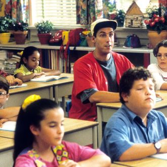 Adam Sandler sitting at a desk in a class for children in a scene from the film 'Billy Madison', 1995. (Photo by Universal Pictures/Getty Images)