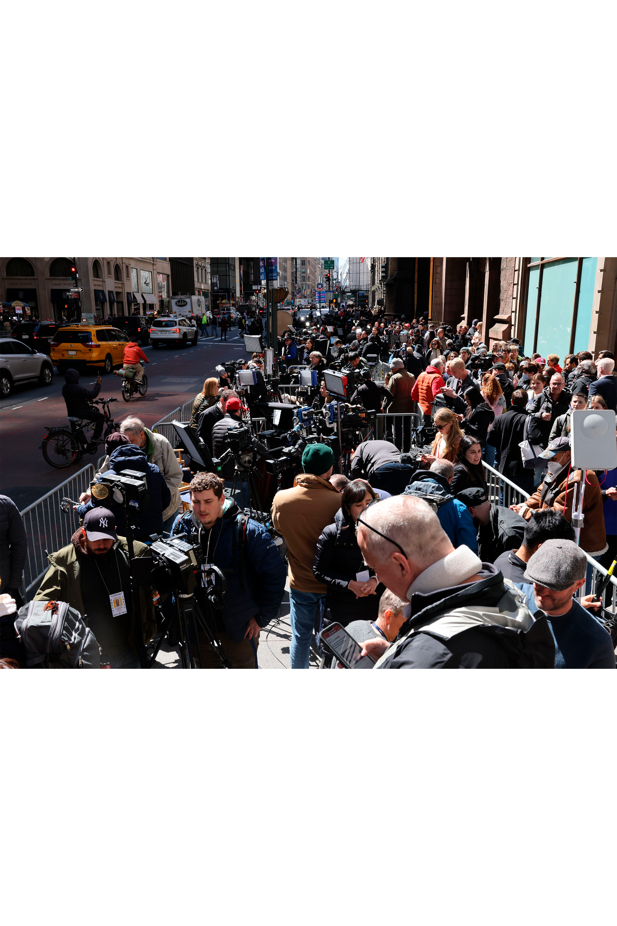 The media scrum as Trump makes one of his increasingly rare visits to his former home base, April 3, 2023.