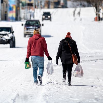 Austin residents bringing home groceries from a nearby gas station on February 15, 2021.