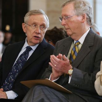 WASHINGTON, DC - JULY 18: Senate Majority Leader Harry Reid (D-NV) (L) and Senate Minority Leader Mitch McConnell (R-KY) speak during a ceremony to celebrate the life Nobel Peace Prize laureate and former South Africa President Nelson Mandela on the occasion of his 95th birthday in the U.S. Capitol Visitor Center July 18, 2013 in Washington, DC. July 18 is Nelson Mandela Day, during which people are asked to give 67 minutes of time to charity and service in their community to honor the 67 years Mandela gave to public service. Mandela was admitted to a South African hospital June 8 where he is being treated for a recurring lung infection. (Photo by Chip Somodevilla/Getty Images)
