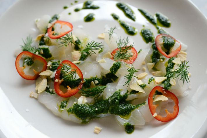 Black-bass crudo with dill, salmoriglio, garlic chips, and Fresno chiles.