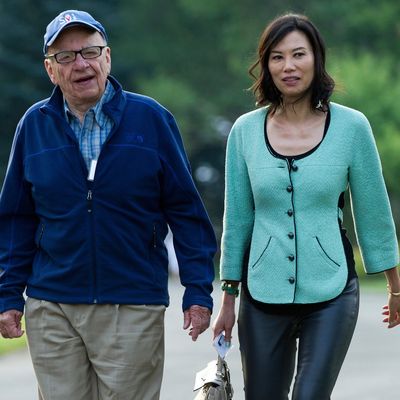 Rupert Murdoch, chairman and chief executive officer of News Corp., left, and his wife Wendi Deng arrive for the morning session at the Allen & Co. Media and Technology Conference in Sun Valley, Idaho, U.S., on Thursday, July 12, 2012. Media moguls gathered at the annual Allen & Co. conference have spent recent years contemplating how to cope with technology companies drawing audiences away from television and movies. 