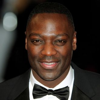 British actor Adewale Akinnuoye-Agbaje poses on the red carpet arriving at the BAFTA British Academy Film Awards at the Royal Opera House in London on February 12, 2012.