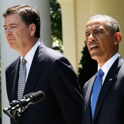 U.S. President Barack Obama (R) speaks during a news conference to announce his nomination of James Comey (L) to become FBI Director in the Rose Garden at the White House June 21, 2013 in Washington, DC. Comey, a former Justice Department official under President George W. Bush, would replace outgoing FBI Director Robert Mueller. 