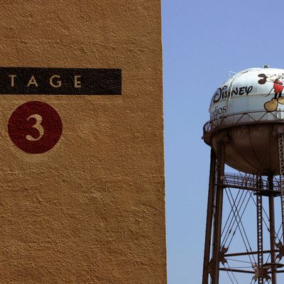 A water tower stands in the distance behind Stage 3 at Walt Disney Studios in Burbank, California, U.S., on Wednesday, June 30, 2010. 
