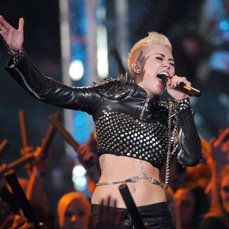 Singer Miley Cyrus performs onstage during 