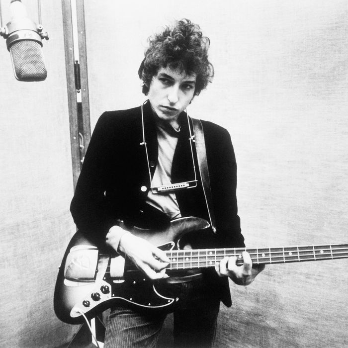 Bob Dylan Holding Bass Guitar
