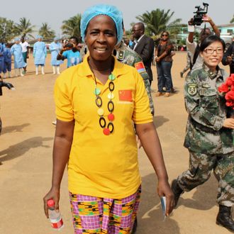 Beatrice Yordoldo, the last confirmed Ebola patient, leaves the Ebola treatment unit (ETU) in the Paynesville suburb of the Liberian capital Monrovia on March 5, 2015. Liberia discharged its last confirmed Ebola patient, as it reported for the first time in nine months it had gone a full week without any new infections. Beatrice Yordoldo left the Chinese-built Ebola treatment unit (ETU) in the Paynesville suburb of the capital Monrovia to cheers from healthcare workers, government officials and aid workers. AFP PHOTO / ZOOM DOSSO (Photo credit should read ZOOM DOSSO/AFP/Getty Images)