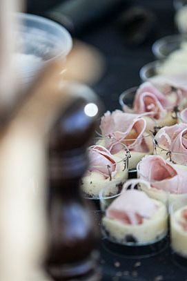 Slices of proscuitto on whipped cotechino.