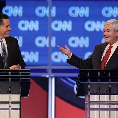 Republican presidential candidate former Speaker of the House Newt Gingrich (R), next to former Massachusetts Gov. Mitt Romney, makes a point during a debate at the North Charleston Coliseum January 19, 2012 in Charleston, South Carolina. The debate, hosted by CNN and the Southern Republican Leadership Conference, is the final debate before South Carolina voters head to the polls for their primary January 21.