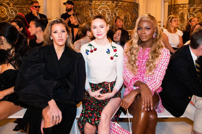 Symone seated in the front row with two other women at Carolina Herrera Spring 2023