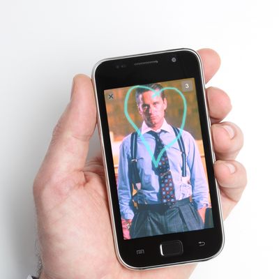 Italy --- Male hand holding a smart phone --- Image by ? Ocean/Corbis