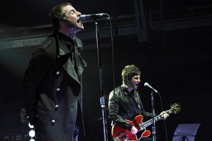 Liam and Noel Gallagher (R) of the band