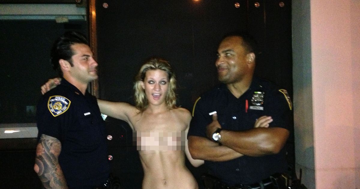 Topless Woman Posing With Cops Is NSFW at the NYPD Either