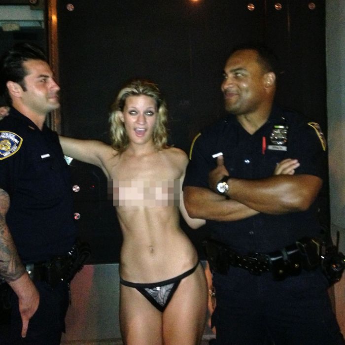 Topless Woman Posing With Cops Is NSFW at the NYPD Either