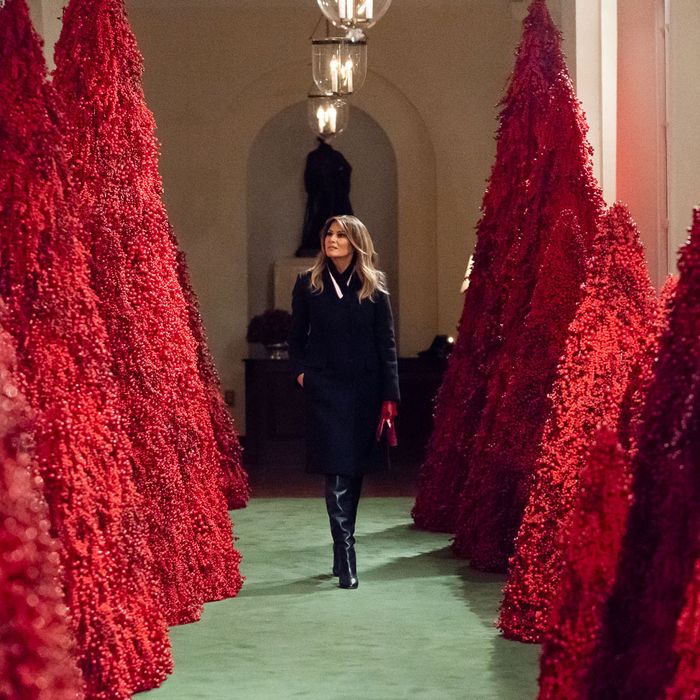 Melania’s Red Christmas Trees Are Being Stripped of Berries