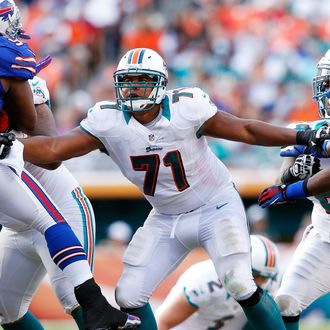 Jonathan Martin #71 of the Miami Dolphins defends along the line against the Buffalo Bills on December 23, 2012 at Sun Life Stadium in Miami Gardens, Florida. 