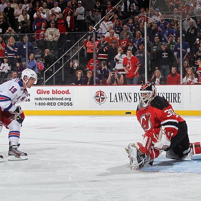 Martin Brodeur #30 of the New Jersey Devils stops a shoot out attempt by Brad Richards #19 of the New York Rangers at the Prudential Center on January 31, 2012 in Newark, New Jersey. 