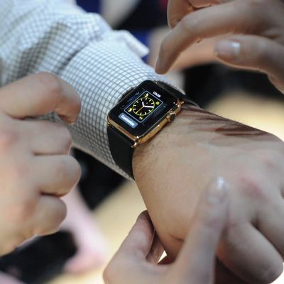 An Apple employee demonstrates how to use an Apple Watch during an Apple media event at the Yerba Buena Center for the Arts in San Francisco, California on March 9, 2015. 