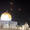 Rocket trails in the sky above the Al-Aqsa Mosque compound in Jerusalem.