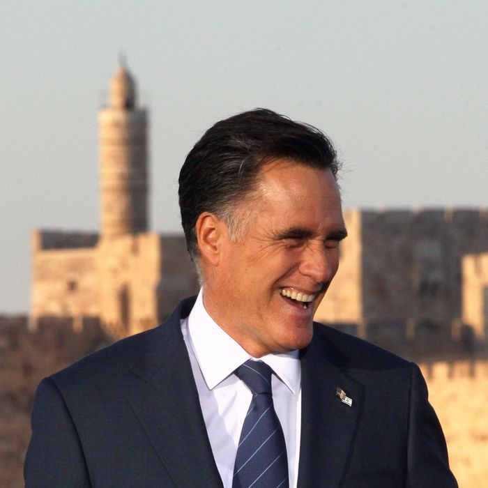 US Repulican party presidential candidate Mitt Romney stands in front of a picture of the Jerusalem Old City walls at an event in Jerusalem on July 29, 2012. Romney hailed Jerusalem as the capital of Israel, in an apparent endorsement of a position held by the Jewish state but never accepted by the international community.