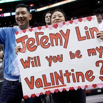 Fans of Jeremy Lin #17 of the New York Knicks cheer during a game against the Toronto Raptors at the Air Canada Centre February 14, 2012 in Toronto, Ontario, Canada.