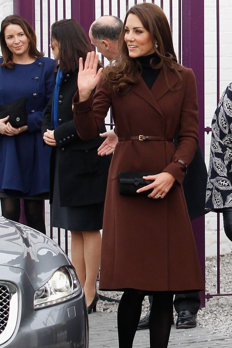 LIVERPOOL, ENGLAND - FEBRUARY 14:  Catherine, Duchess of Cambridge arrives at Liverpool charity The Brink on February 14, 2012 in Liverpool, England. Catherine, The Duchess of Cambridge is in Liverpool visiting charities in the city without husband Prince William who is serving in the Falklands. During the visit to The Brink, an alcohol free bar, she was presented with a Valentine’s Day cupcake, cards and flowers by eight-year-old Jaqson Johnston-Lynch. Later she is to visit Alder Hey Children’s Hospital and Ronald McDonald House.  (Photo by Christopher Furlong/Getty Images)