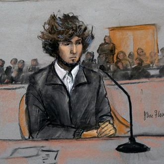 In this courtroom sketch, Boston Marathon bombing suspect Dzhokhar Tsarnaev is depicted sitting in federal court in Boston Thursday, Dec. 18, 2014, for a final hearing before his trial begins in January. Tsarnaev is charged with the April 2013 attack that killed three people and injured more than 260. He could face the death penalty if convicted. (AP Photo/Jane Flavell Collins)