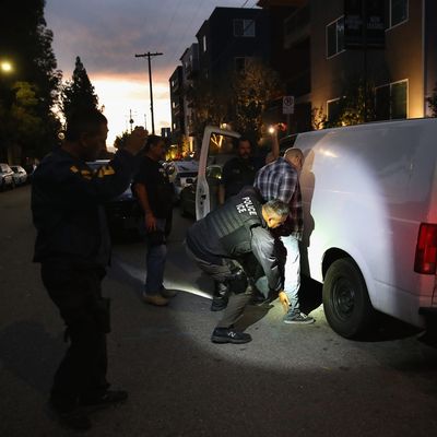 ICE agents carrying out an arrest.