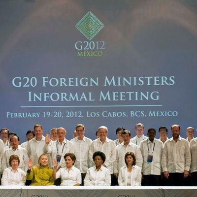 US Secretary of State Hillary Rodham Clinton(C front), Catherine Ashton, EU High Representative for Foreign and Security Policy (L front), Mexico's Foreign Minister Patricia Espinosa (2ndR), and South Africia's Foreign Minister Maite Nkoana-Mashabane pose with other representatives during the G20 foreign ministers family photo in Los Cabos, Mexico, on February 20, 2012. 
