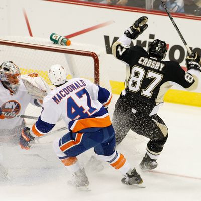 PITTSBURGH, PA - NOVEMBER 21: Sidney Crosby #87 of the Pittsburgh Penguins celebrates after his first goal of the season against Anders Nilsson #45 of the New York Islanders during the game on November 21, 2011 at CONSOL Energy Center in Pittsburgh, Pennsylvania. Crosby has not played a game since January 5th after sustaining a concussion. (Photo by Jared Wickerham/Getty Images)